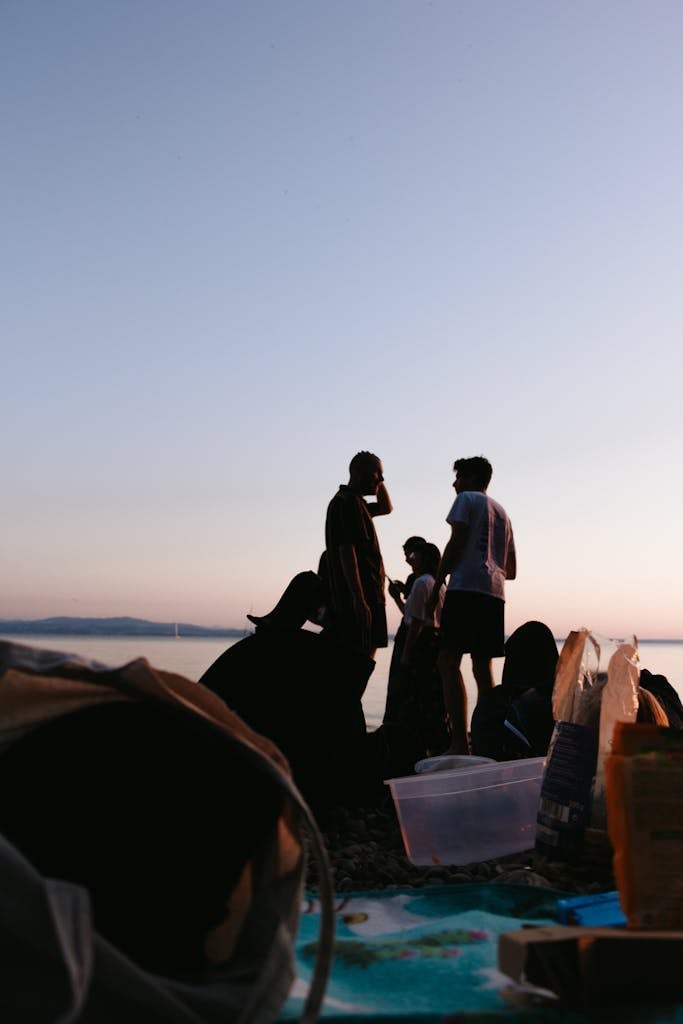 People Sitting on Brown Sand